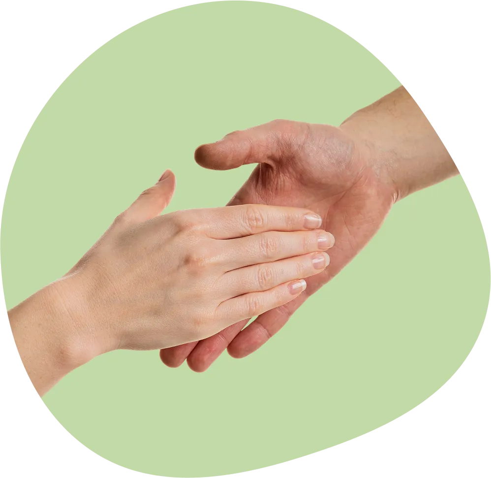 Two hands reaching out and holding each other in support